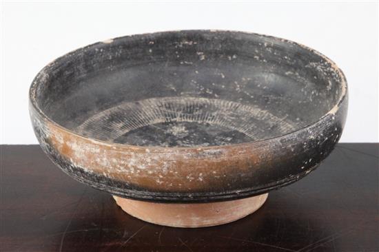 A Greek blackware rouletted bowl, Apulia c 4th century B.C., 17.5cm